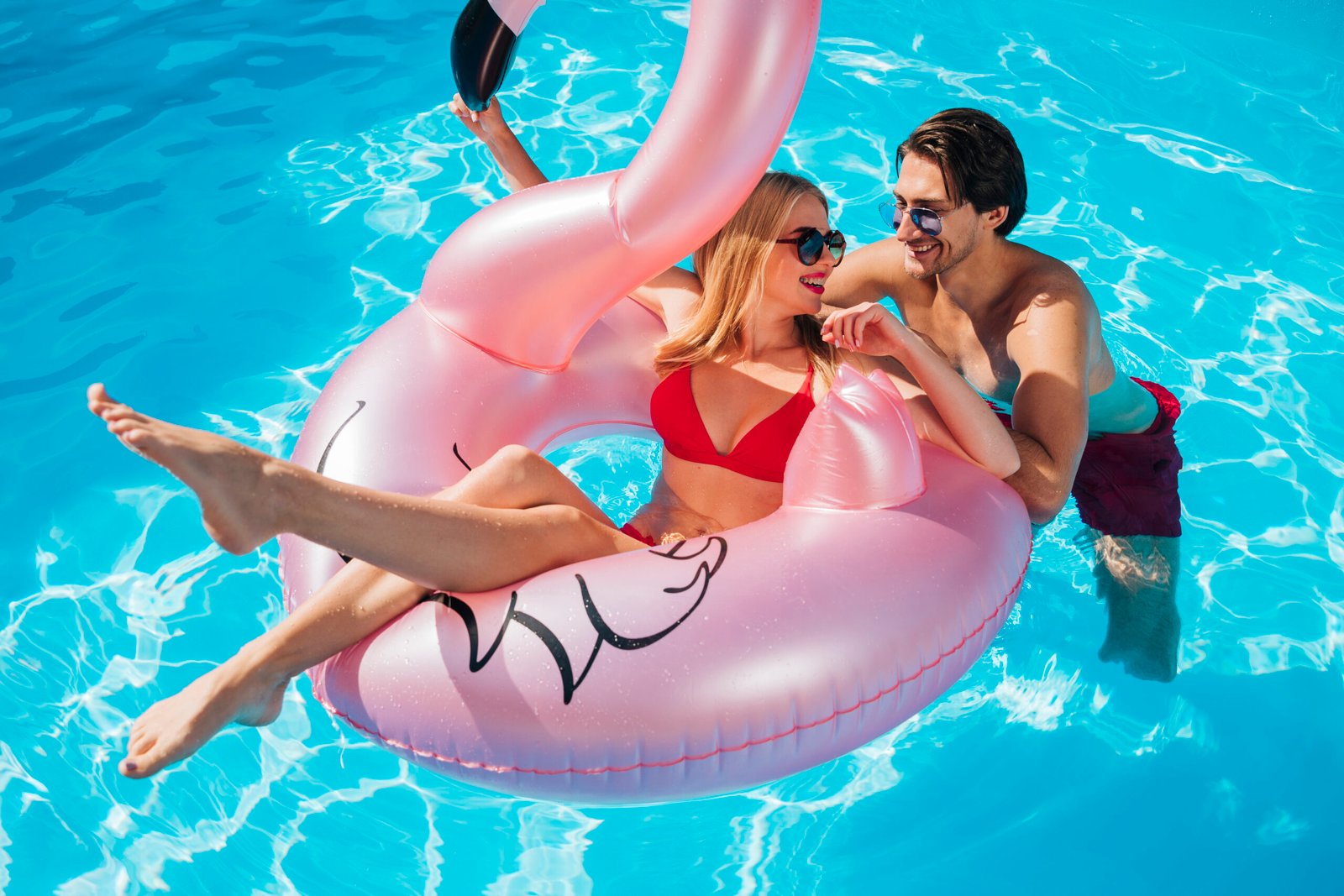 friends-smiling-each-other-pool